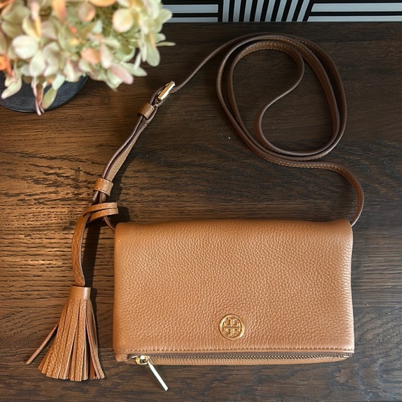 Tory Burch Handbags - Tory Burch fold over crossbody bag. Camel color. Slim design.